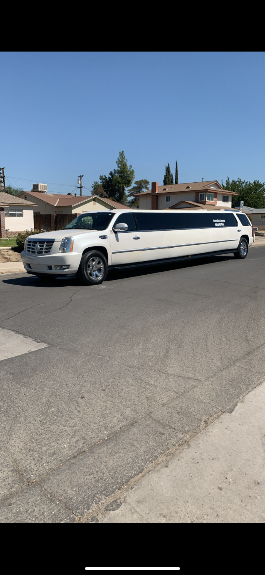 White Cadillac Escalade stretch limousine